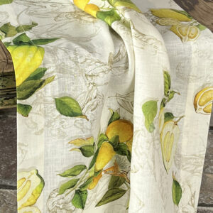 Close view of the Limoncello pure linen runner with lemons, citrons, green leaves, and naturalistic motifs