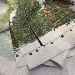 Close-up of the pure linen texture and decorated trees on the Fairy Trees tablecloth