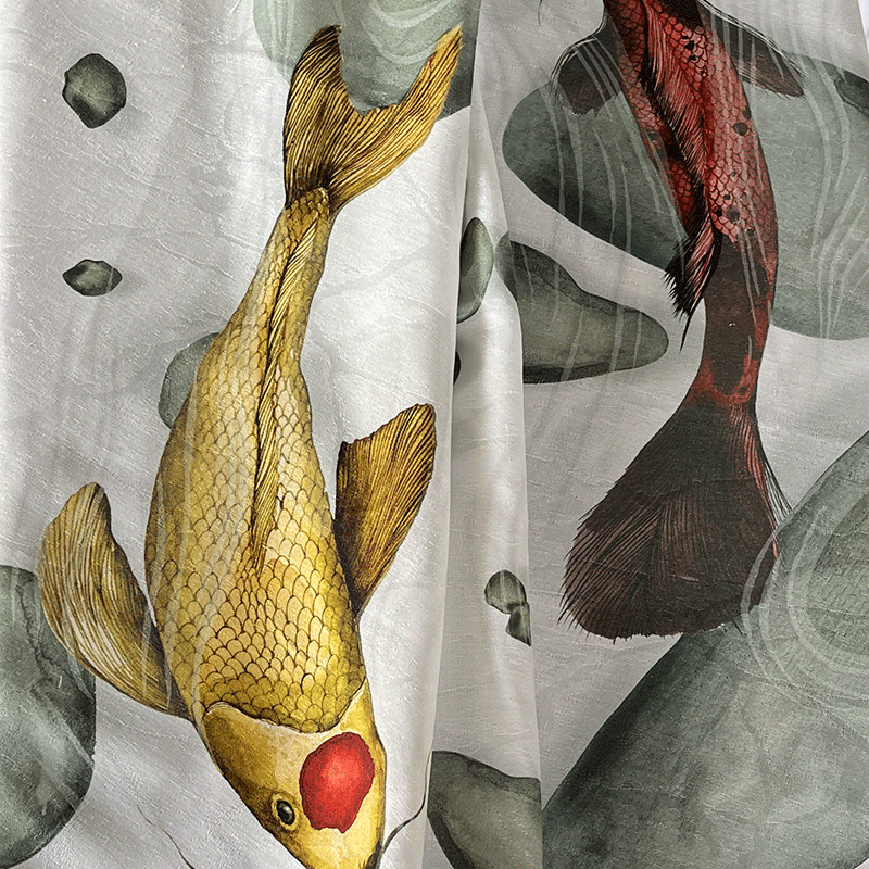 Carpe linen-cotton jacquard tablecloth-La-Bottega-di-Casa Close-up of the Carpe linen-cotton jacquard tablecloth with gold and red carp, showing the textured tone-on-tone weave beneath the print.