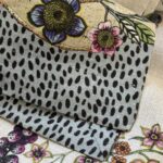 Close-up of the mitered corner and botanical print on the Biloba pure linen tablecloth