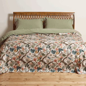 cotton bedspread with a sophisticated, nature-inspired design featuring lush foliage and delicate flowers