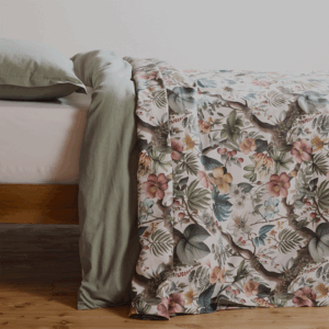 cotton bedspread with a sophisticated, nature-inspired design featuring lush foliage and delicate flowers