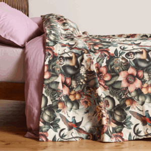 bedspread with a lively, tropical design featuring exotic flower patterns and playful monkeys