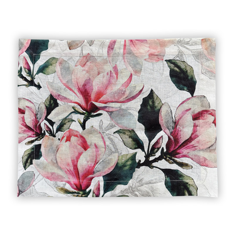 Tovaglietta-magnolia-rosa-La-Bottega-di-Casa Magnolia Rosa linen placemat on white background — large magnolia flowers in dusty pink and carmine with dark green foliage in watercolour