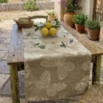 Fauna Crema linen table runner with woven butterfly design
