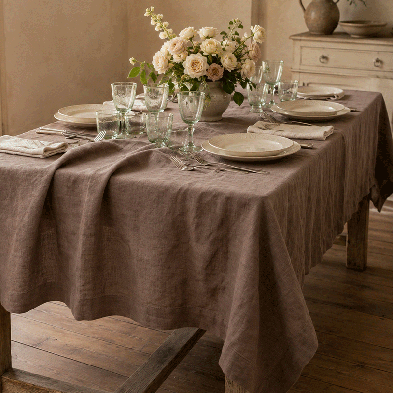 luxury-Taupe Vintage Linen Tablecloth-La-Bottega-di-Casa Taupe linen tablecloth set on a rustic wood table with ceramic plates and crystal glasses