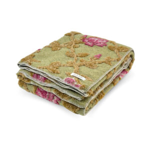 Folded Grace Verde boiled wool throw with raised raspberry-pink flowers and ocher stems on green, finished with light edge stitching.
