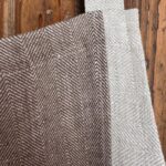Herringbone and striped linen fabric details on brown one of a kind apron